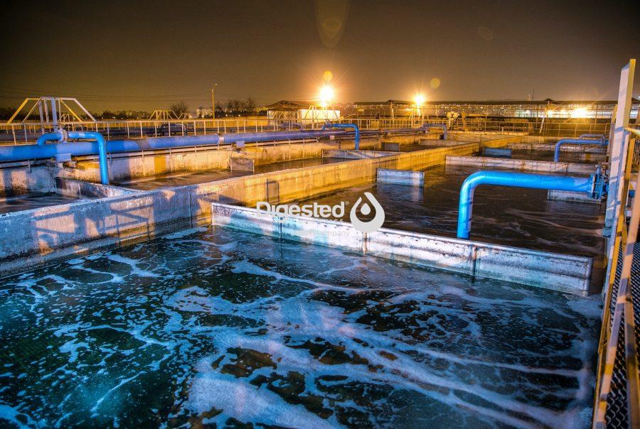 wastewater treatment plant of chemical factory at night. Water purification tanks